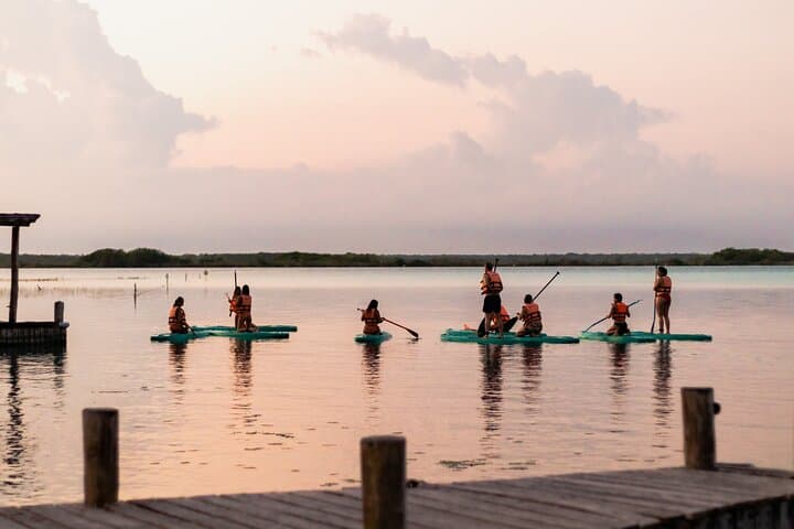 Paddleboarding and/or kayaking tour at sunrise in the lagoon of Bacalar