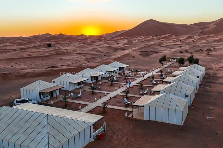 Overnight stay in luxury desert camp camel ride &sandboarding