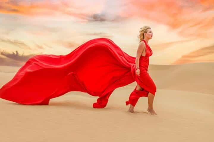 Flying Dress Photography in Desert Dunes of Dubai With Transfers