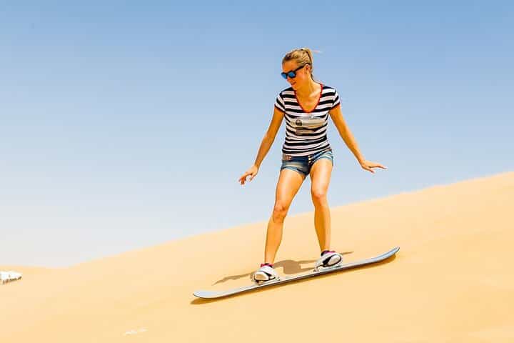 Desert Safari with BBQ Dinner, Camel Ride, Sand Board & Live Show